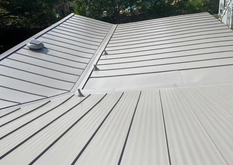 Solar attic fan installed on a metal roof for Roof Ventilation in Penn